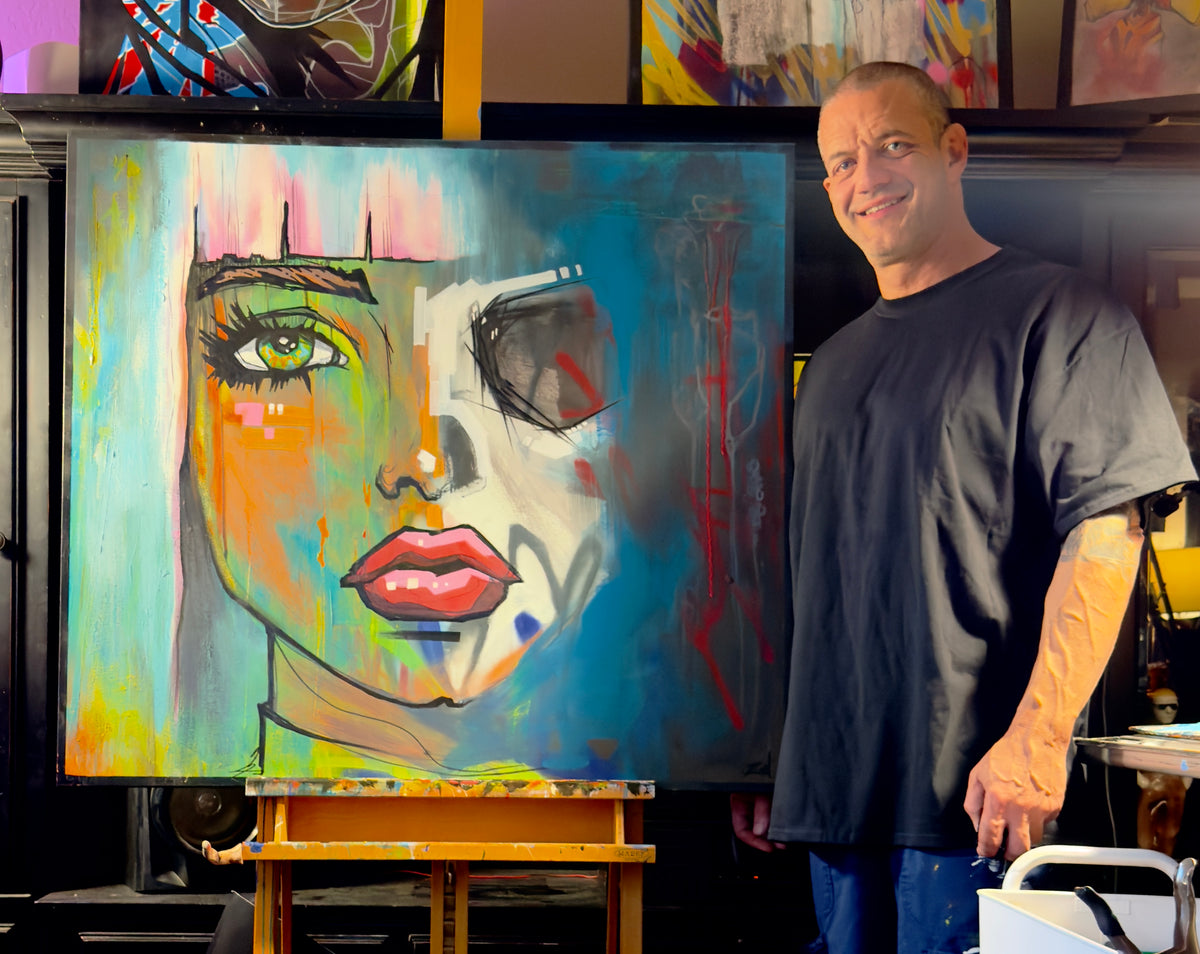 Zon Carvalho standing beside Amani in his studio, showing the 36 x 40 inch scale of the original